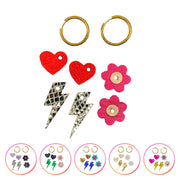 Box de créoles interchangeables avec trois pampilles — marguerites, cœurs et éclairs — pour changer de style chaque jour. Une nouveauté brillante et personnalisable pour l’hiver. ✨